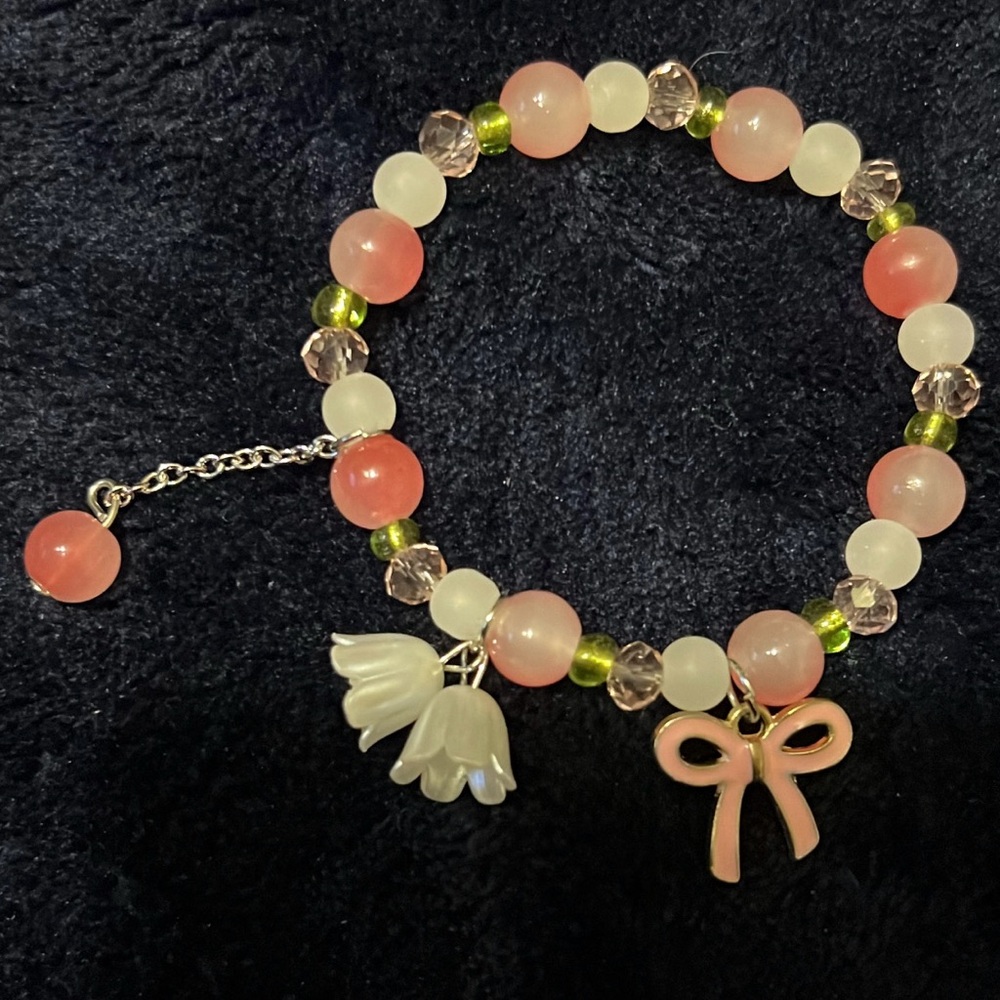 Pink and White Beaded Bracelet with Bow Charm